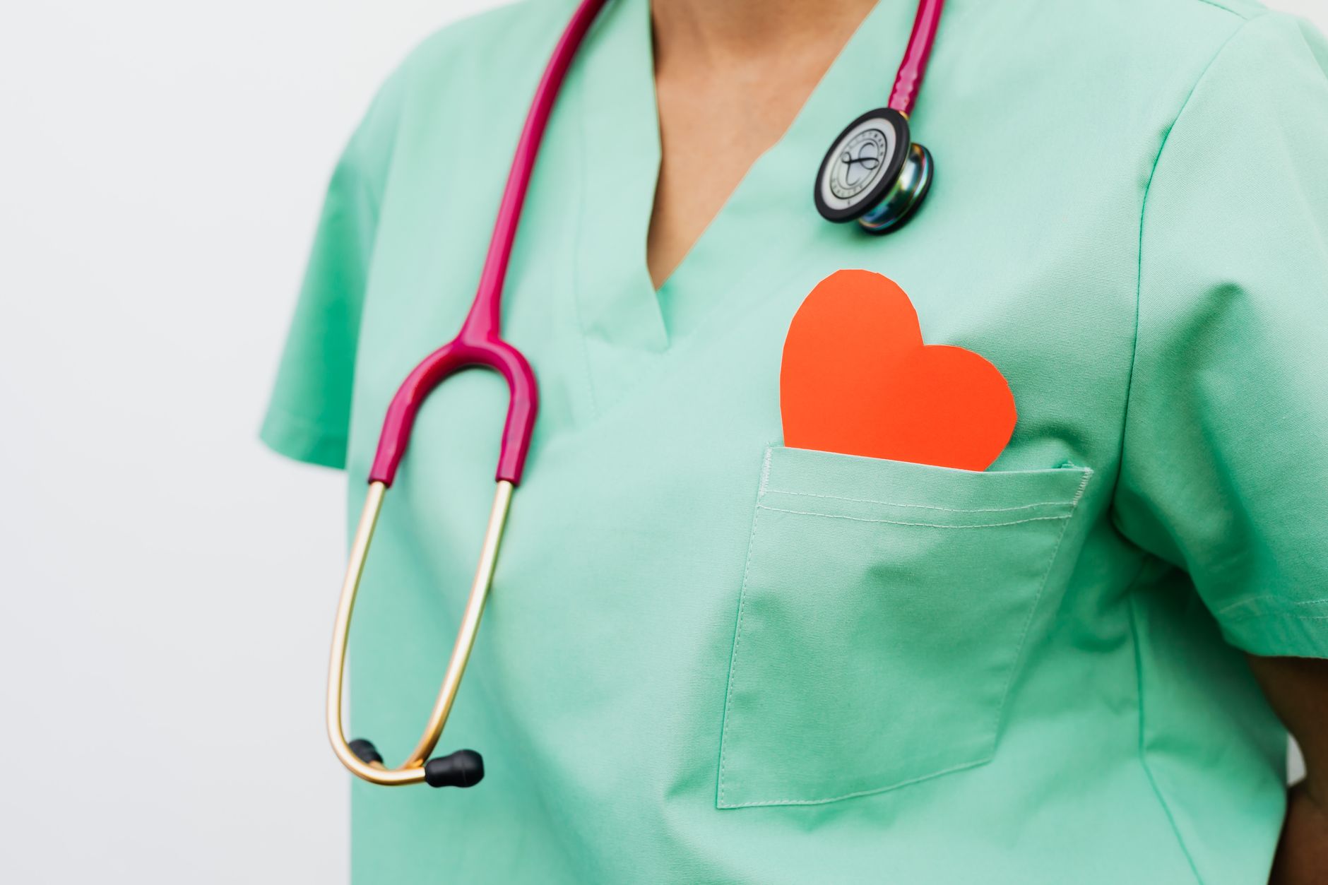 A healthcare professional with a stethoscope and red heart symbol emphasizes cardiology care. — Different Ways CBD can Help Y