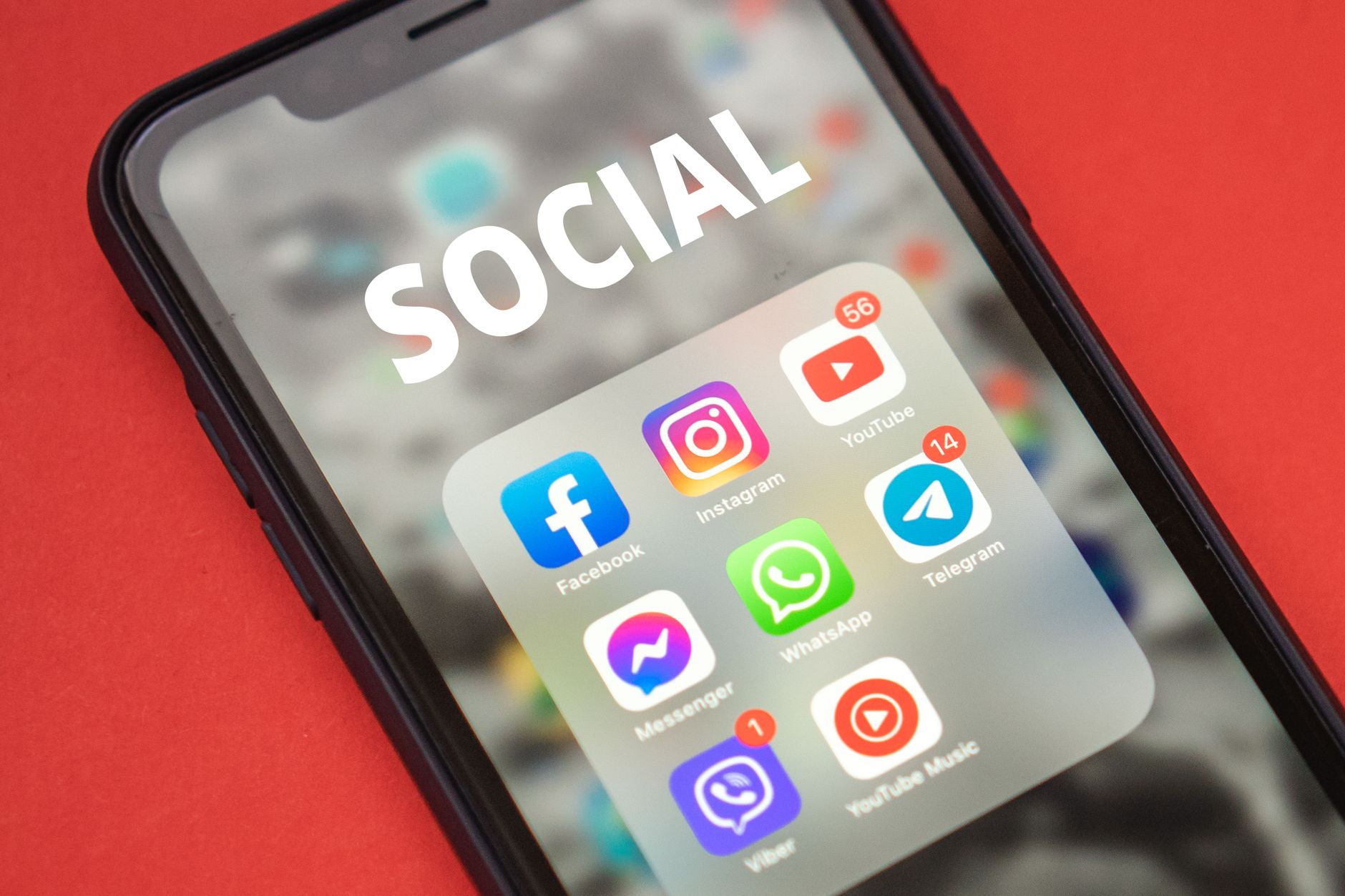 Close-up of a smartphone showing popular social media apps on screen. — Elevate Your Instagram Game: A Guide to Buying Reels
