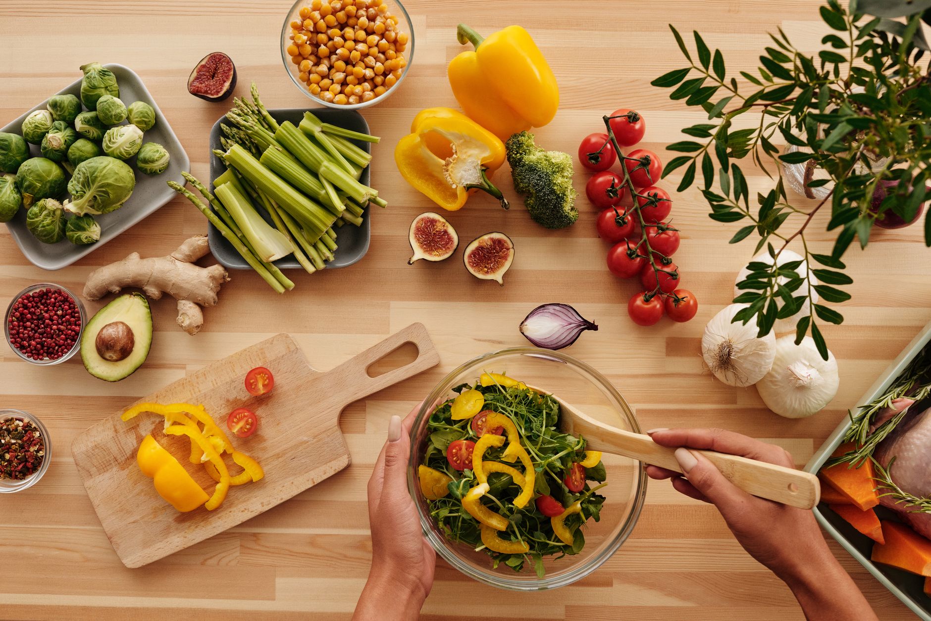 Top view of fresh vegetables and salad preparation on a wooden table, perfect for healthy eating concepts. — Exactly why is t