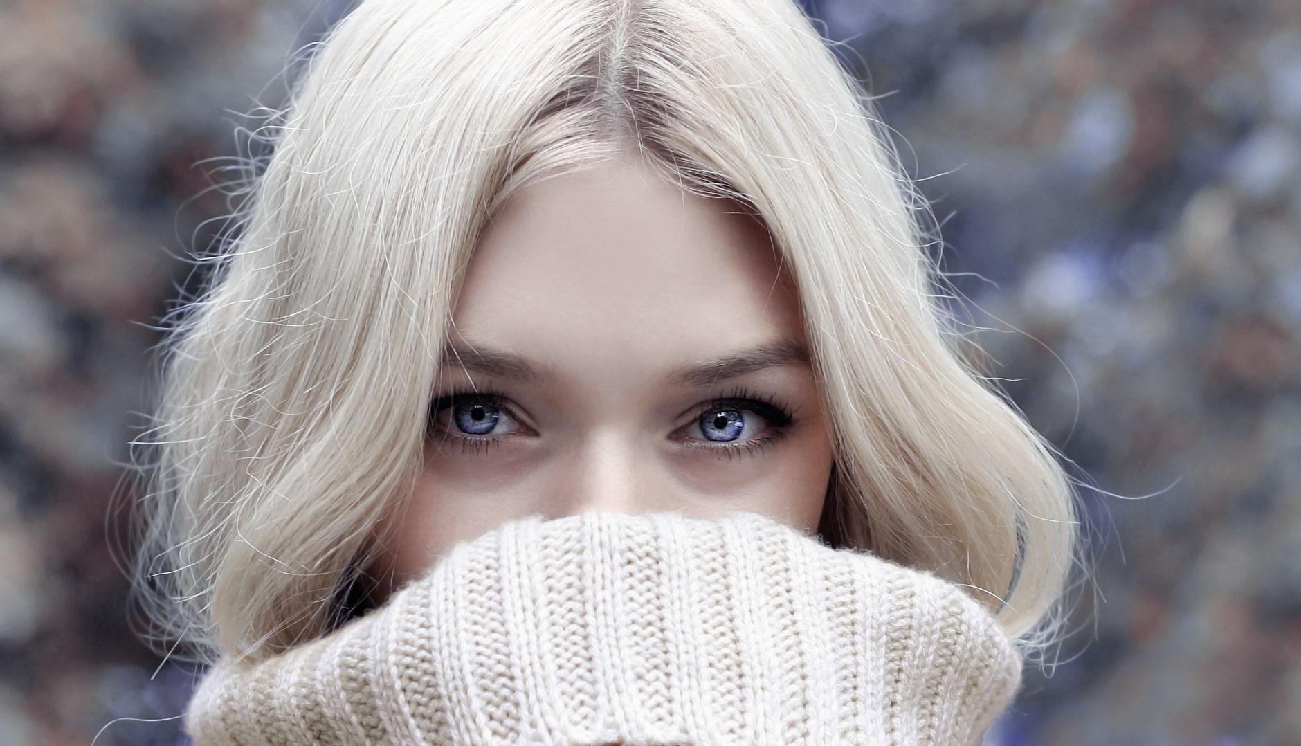 A close-up portrait of a blonde woman in winter attire, emphasizing her eyes. — Five Wicker Furniture Living Sets That Enhanc