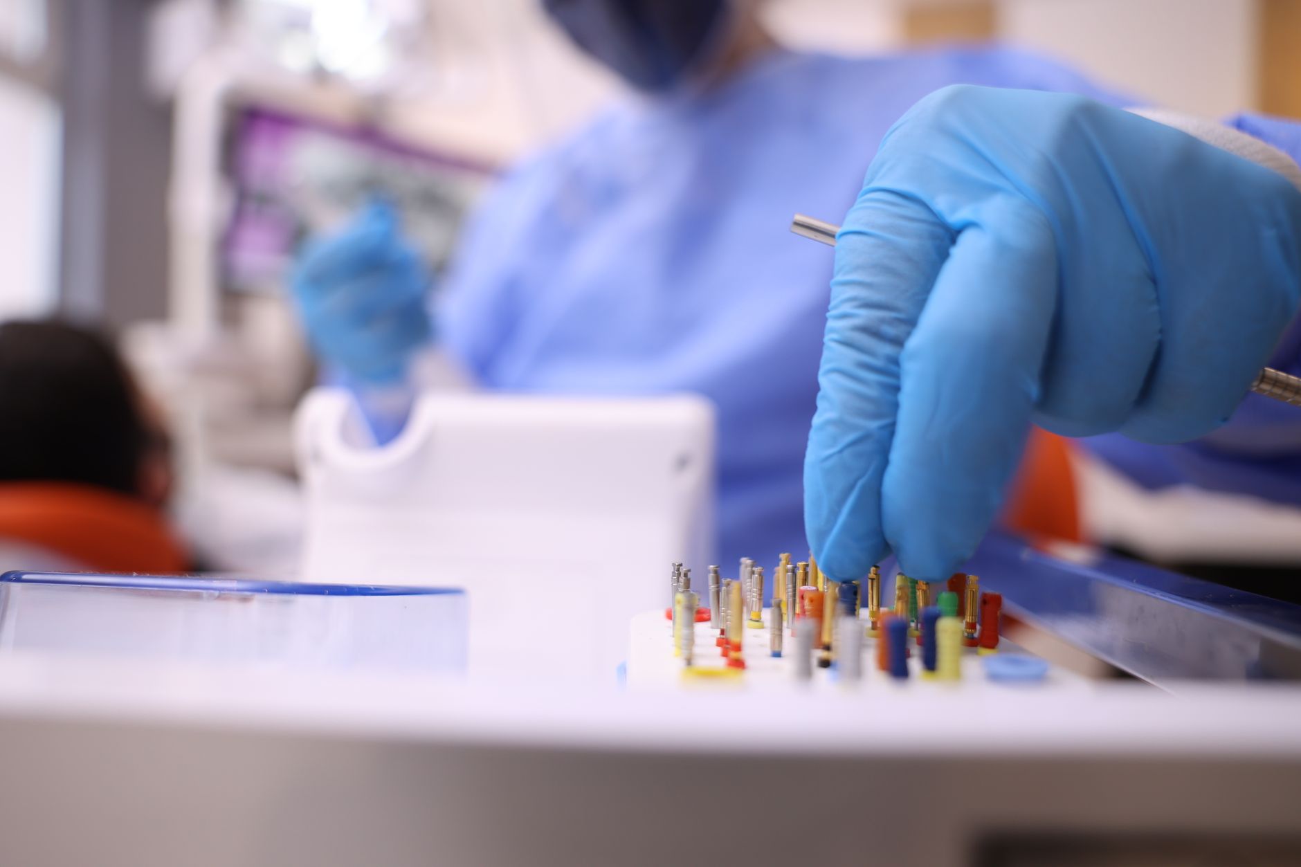 Detailed shot of a dentist selecting dental tools for a procedure in a clinic. — Free Dental Check-Up For You Personally