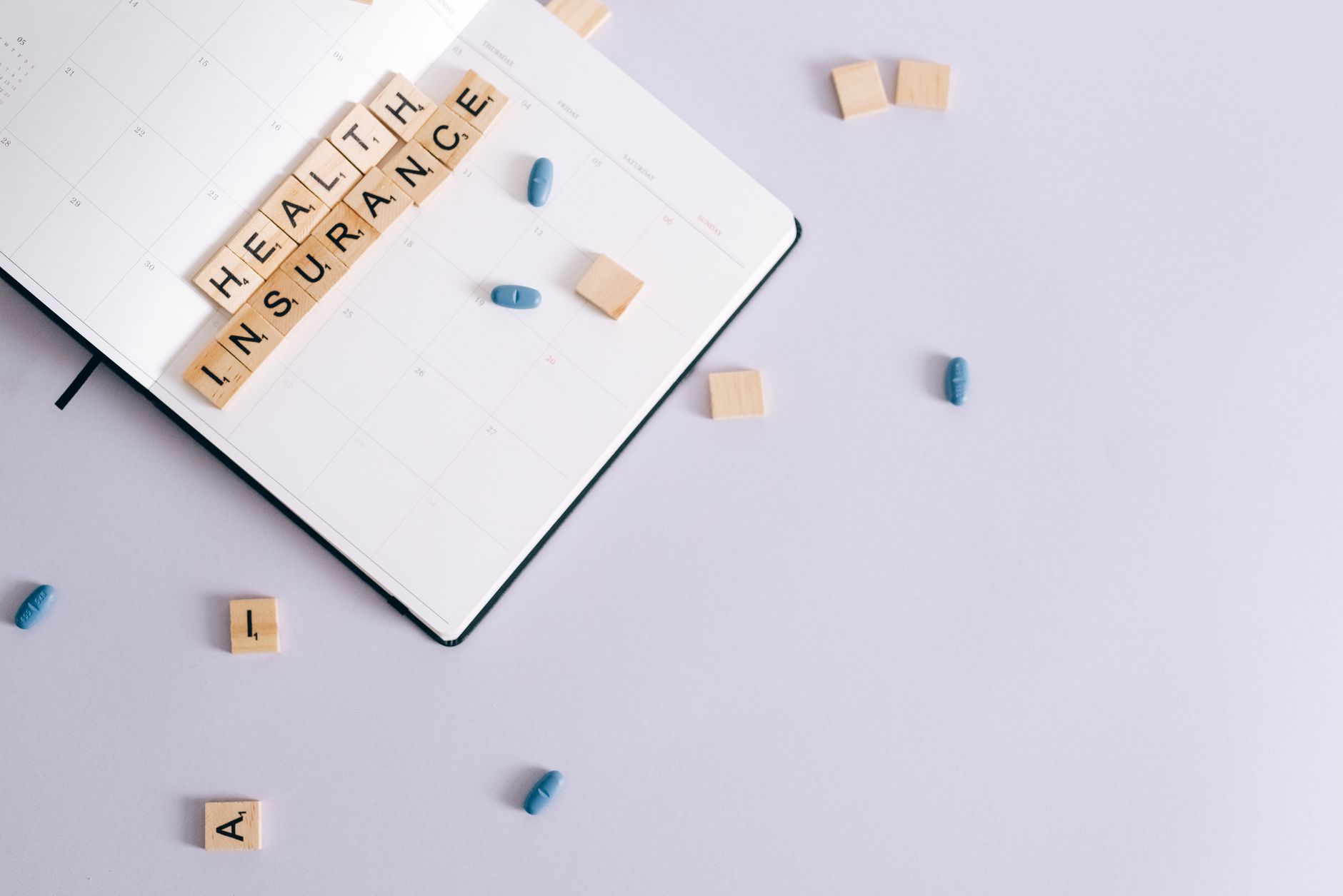Flat lay of health insurance concept with planner and pills. — Get The Best Sleep Apnoea Treatment In Sutherland Shire