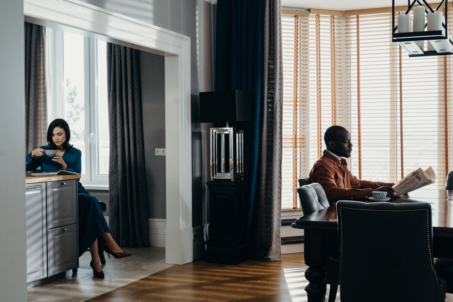 Elegant indoor scene featuring a couple enjoying a relaxed moment in a luxury apartment setting. — hii