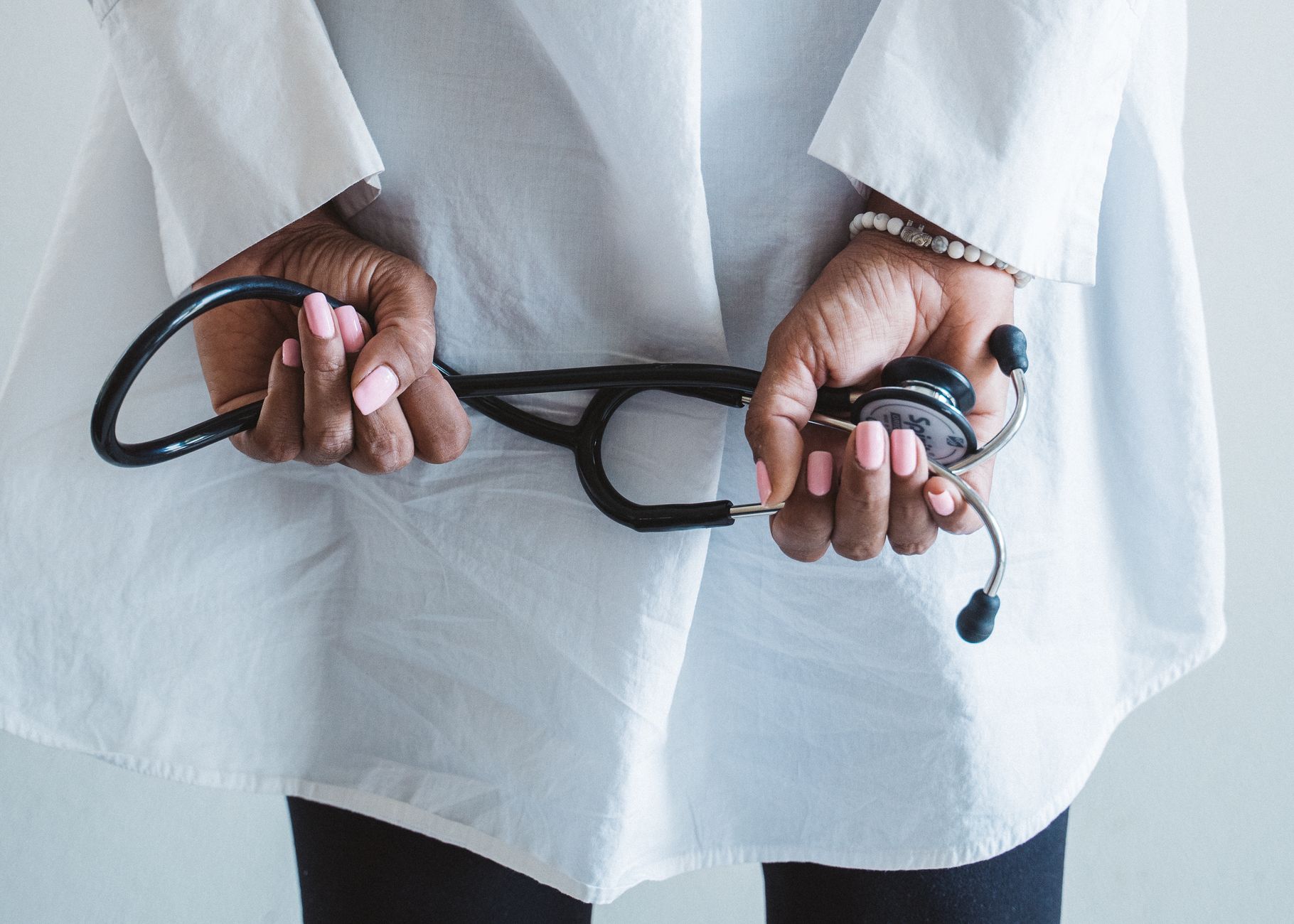 A medical professional holding a stethoscope in a clinical setting. — Medicare plans 2021: Top Advantages