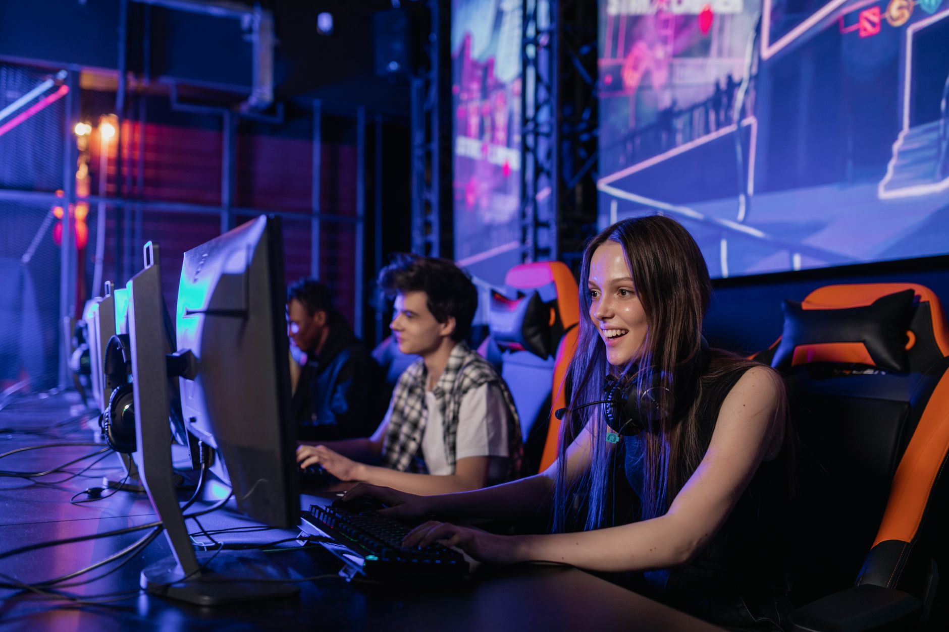 A group of young adults enjoying a gaming session in a vibrant esports arena. — Play Live Dealer Games at Canadian Online Cas