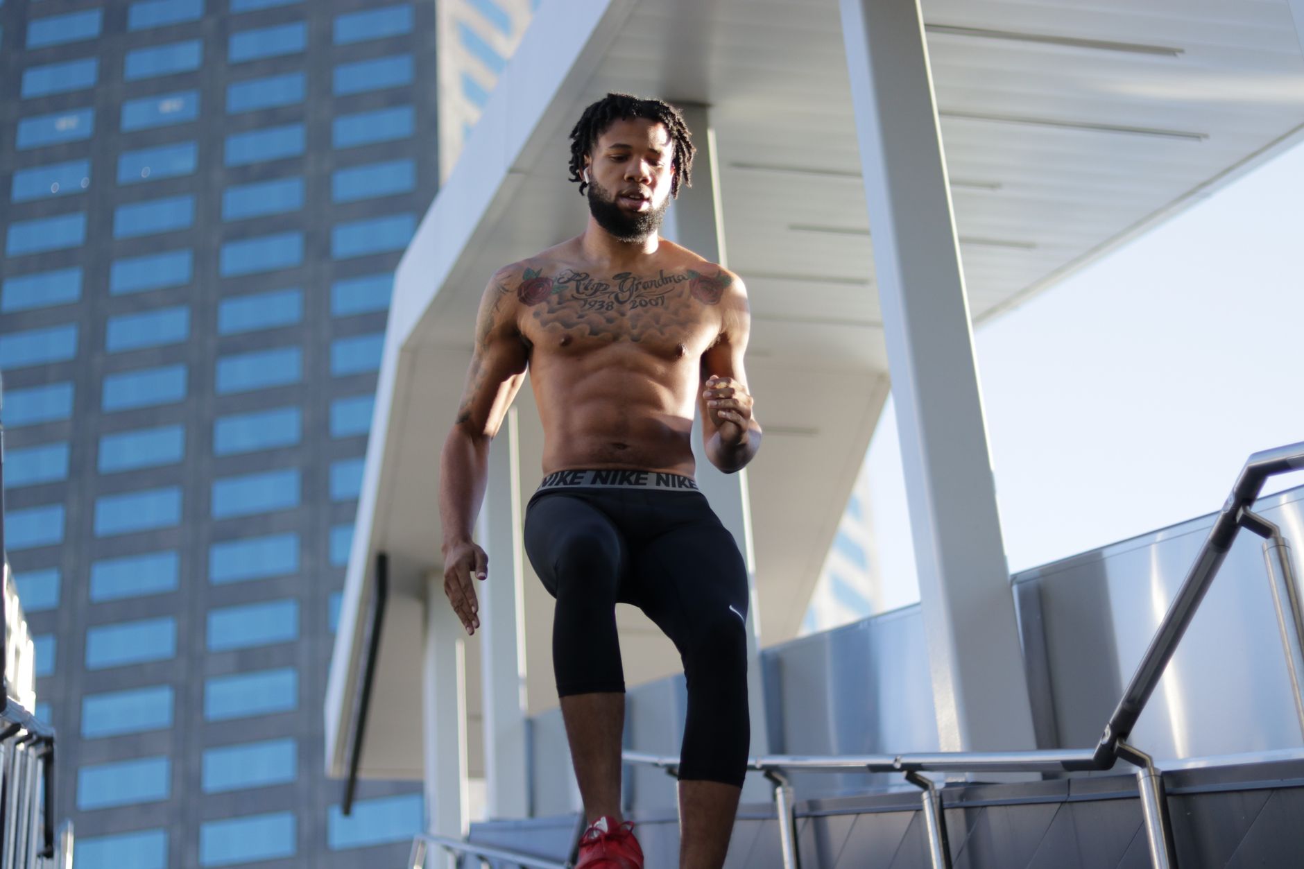 Fit man running shirtless outdoors, showcasing muscular physique during a workout. — Taking Women's Fitness One Stage Further