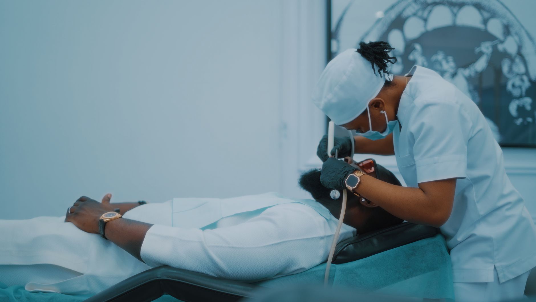 A dental professional performs a procedure on a patient in a Lagos clinic. — The 5 Major Benefits Of Choosing Private GP