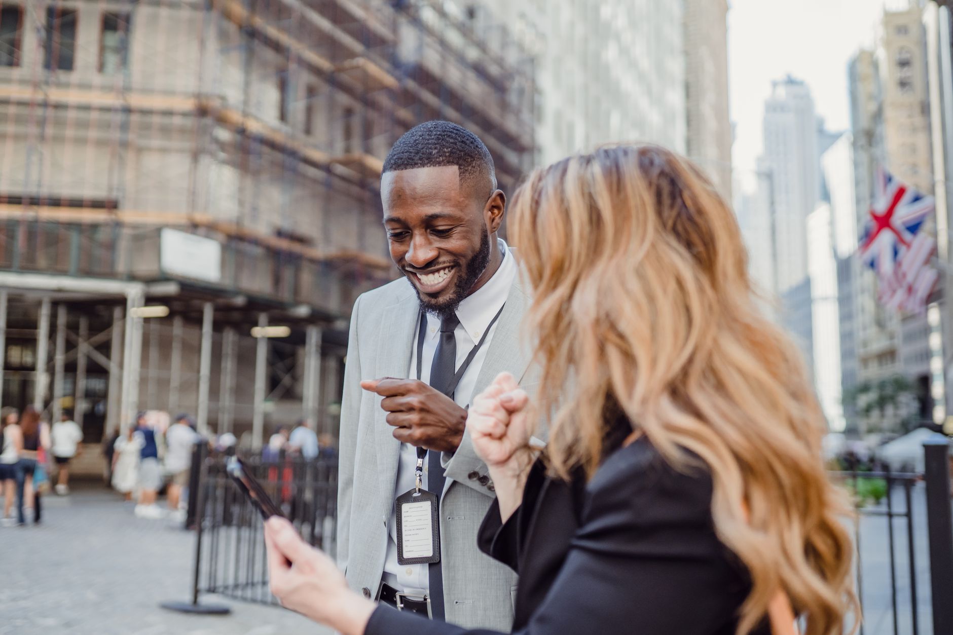 Two business professionals engage in lively conversation on an urban street, sharing insights. — The Ultimate Checklist for C